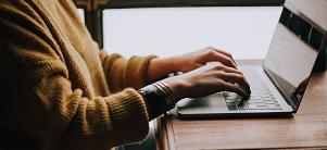 Women at laptop (Photo: Christin Hume/Unsplash)